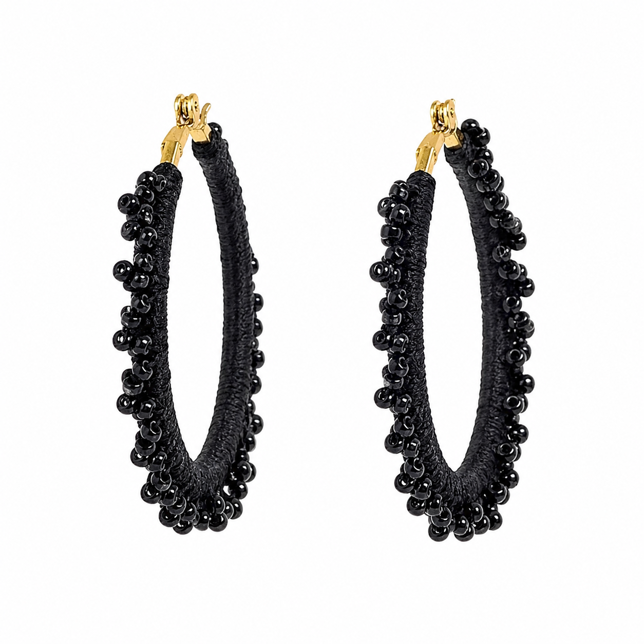 Black hand-crocheted beaded round hoop earrings with glossy black beads, handmade lightweight waterproof jewellery