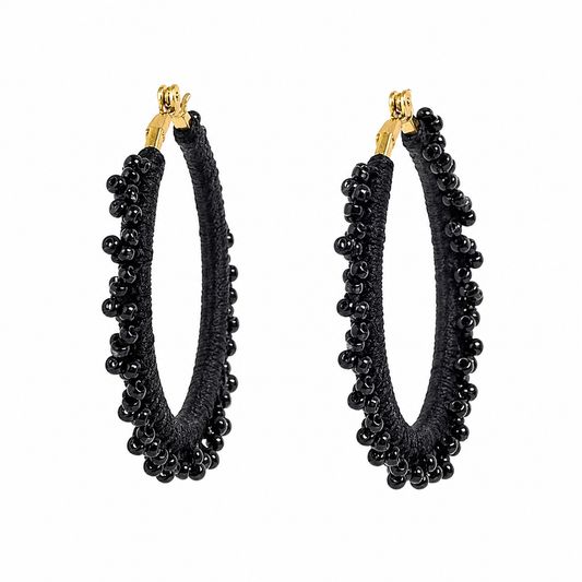 Black hand-crocheted beaded round hoop earrings with glossy black beads, handmade lightweight waterproof jewellery